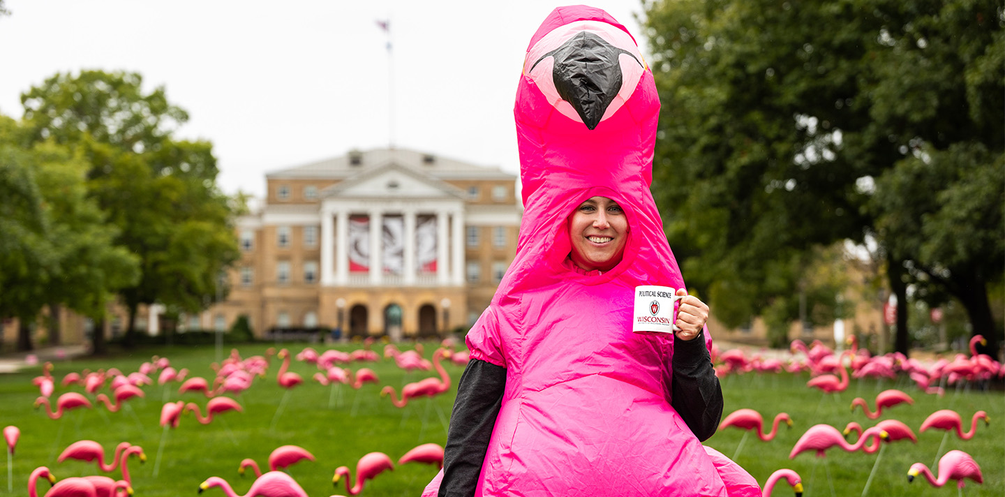 Student in a flamingo suit poses on Bascom Hill
